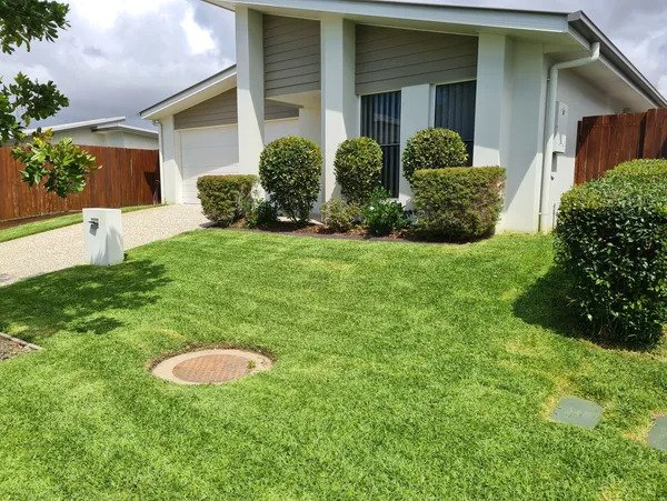 About Us - trimmed green lawn
